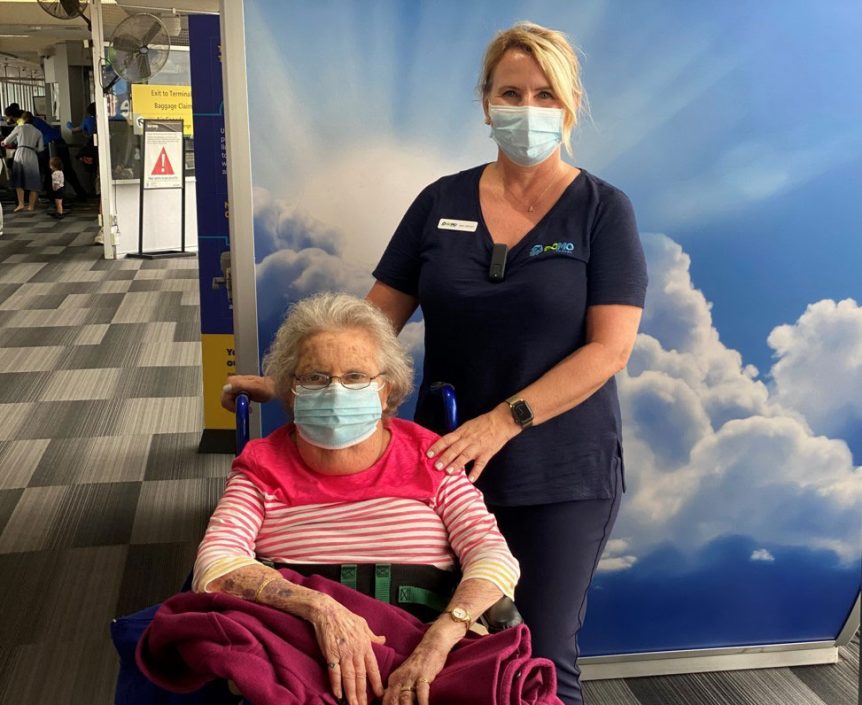 Kerri Johnson with elderly client on wheelchair
